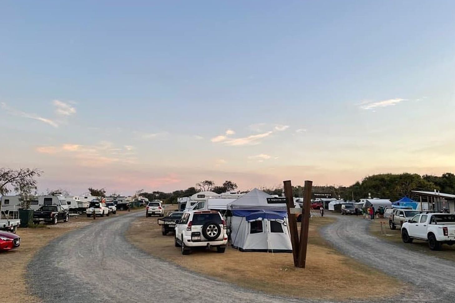 a caravan park on the side of a river